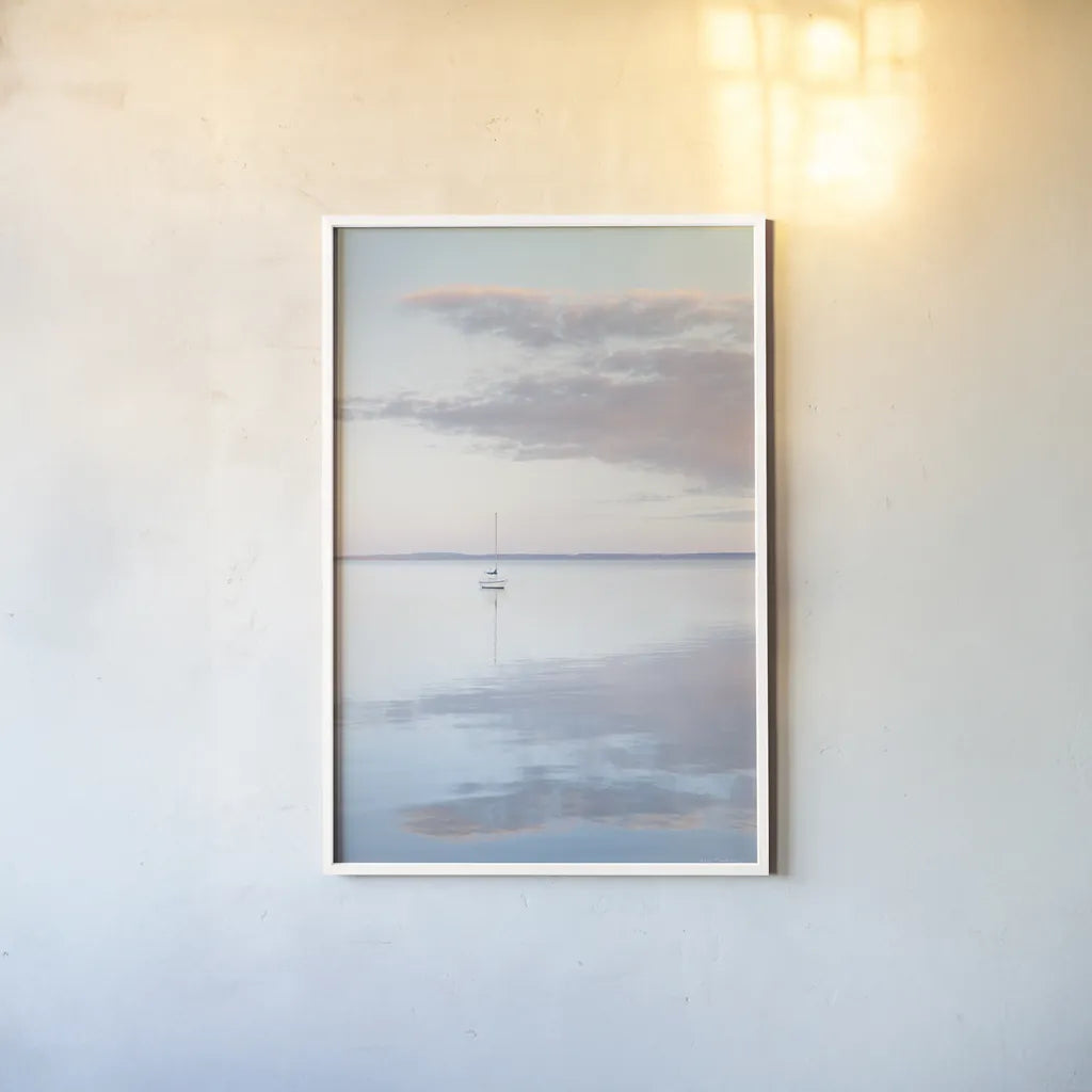 Sailboat in Bellingham Bay II by Alan Majchrowicz. shown as a paper print in a white frame. Available as a archival giclee rolled canvas, fine art paper, or poster print. SKU 61440h.