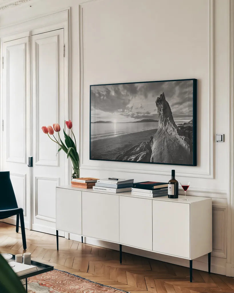 Samish Bay Sunset I BW by Alan Majchrowicz. shown as a framed stretched canvas in a living room above a console. Available as a archival giclee rolled canvas, fine art paper, or poster print. SKU 33851i.