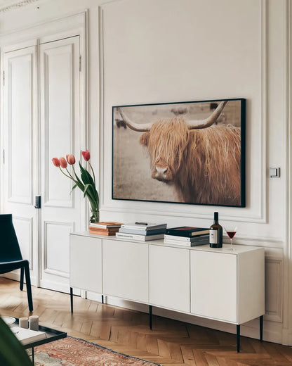 Scottish Highland Cattle I Neutral by Alan Majchrowicz. shown as a framed stretched canvas in a living room above a console. Available as a archival giclee rolled canvas, fine art paper, or poster print. SKU 53120i.