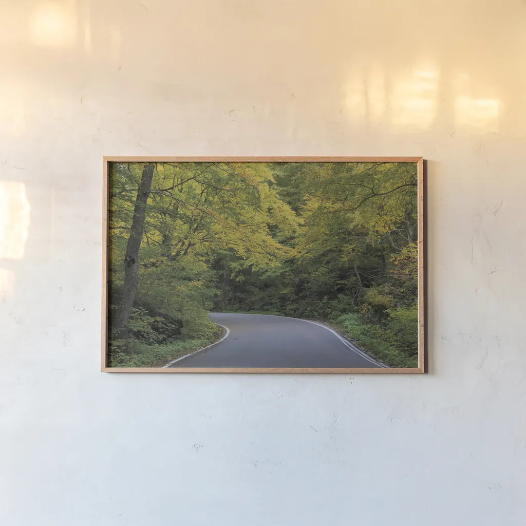 Smugglers Notch Road by Alan Majchrowicz. shown as a paper print in a natural frame. Available as a archival giclee rolled canvas, fine art paper, or poster print. SKU 62467i.