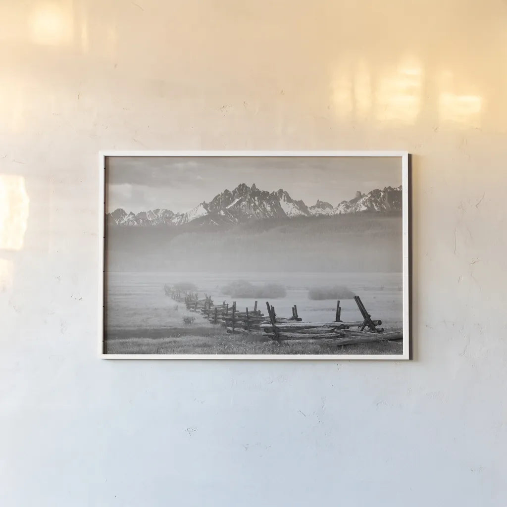 Stanley Basin Fence and Fog by Alan Majchrowicz. shown as a paper print in a white frame. Available as a archival giclee rolled canvas, fine art paper, or poster print. SKU 64561i.