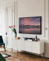 Sunrise Over Mount Baker by Alan Majchrowicz. shown as a framed stretched canvas in a living room above a console. Available as a archival giclee rolled canvas, fine art paper, or poster print. SKU 28090i.
