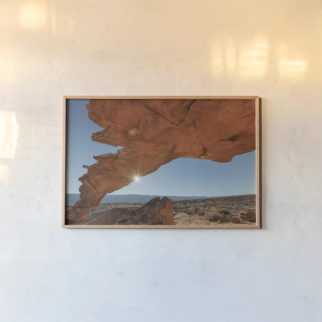 Sunset Arch Grand Staircase Escalante National Monument by Alan Majchrowicz. shown as a paper print in a natural frame. Available as a archival giclee rolled canvas, fine art paper, or poster print. SKU 80813i.