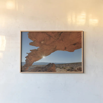 Sunset Arch Grand Staircase Escalante National Monument by Alan Majchrowicz. shown as a paper print in a natural frame. Available as a archival giclee rolled canvas, fine art paper, or poster print. SKU 80813i.
