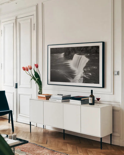 Tahquamenon Falls Michigan I BW by Alan Majchrowicz. shown as a framed stretched canvas in a living room above a console. Available as a archival giclee rolled canvas, fine art paper, or poster print. SKU 50169i.