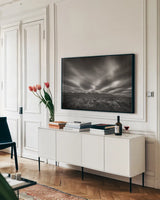 Teton Sky by Alan Majchrowicz. shown as a framed stretched canvas in a living room above a console. Available as a archival giclee rolled canvas, fine art paper, or poster print. SKU 64566i.