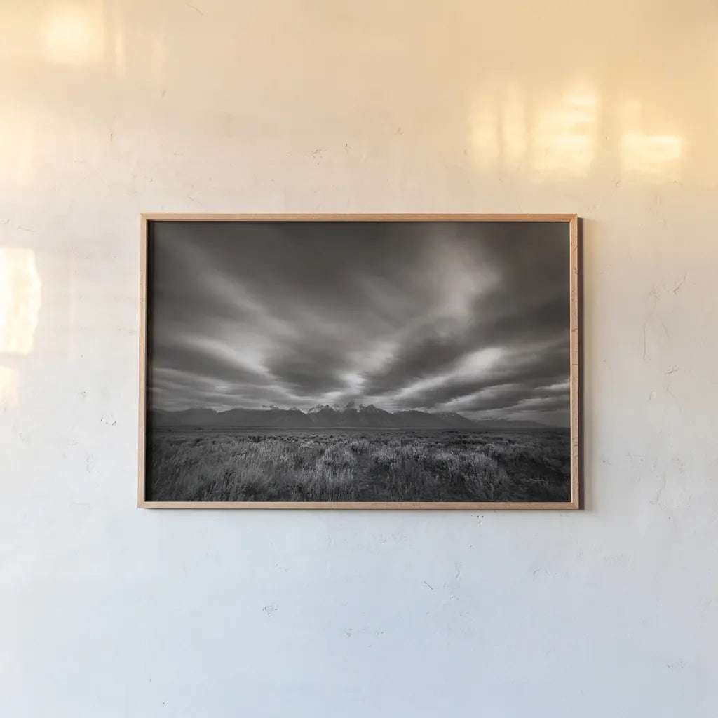 Teton Sky by Alan Majchrowicz. shown as a paper print in a natural frame. Available as a archival giclee rolled canvas, fine art paper, or poster print. SKU 64566i.