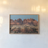The Needles Canyonlands National Park by Alan Majchrowicz. shown as a paper print in a natural frame. Available as a archival giclee rolled canvas, fine art paper, or poster print. SKU 80814i.