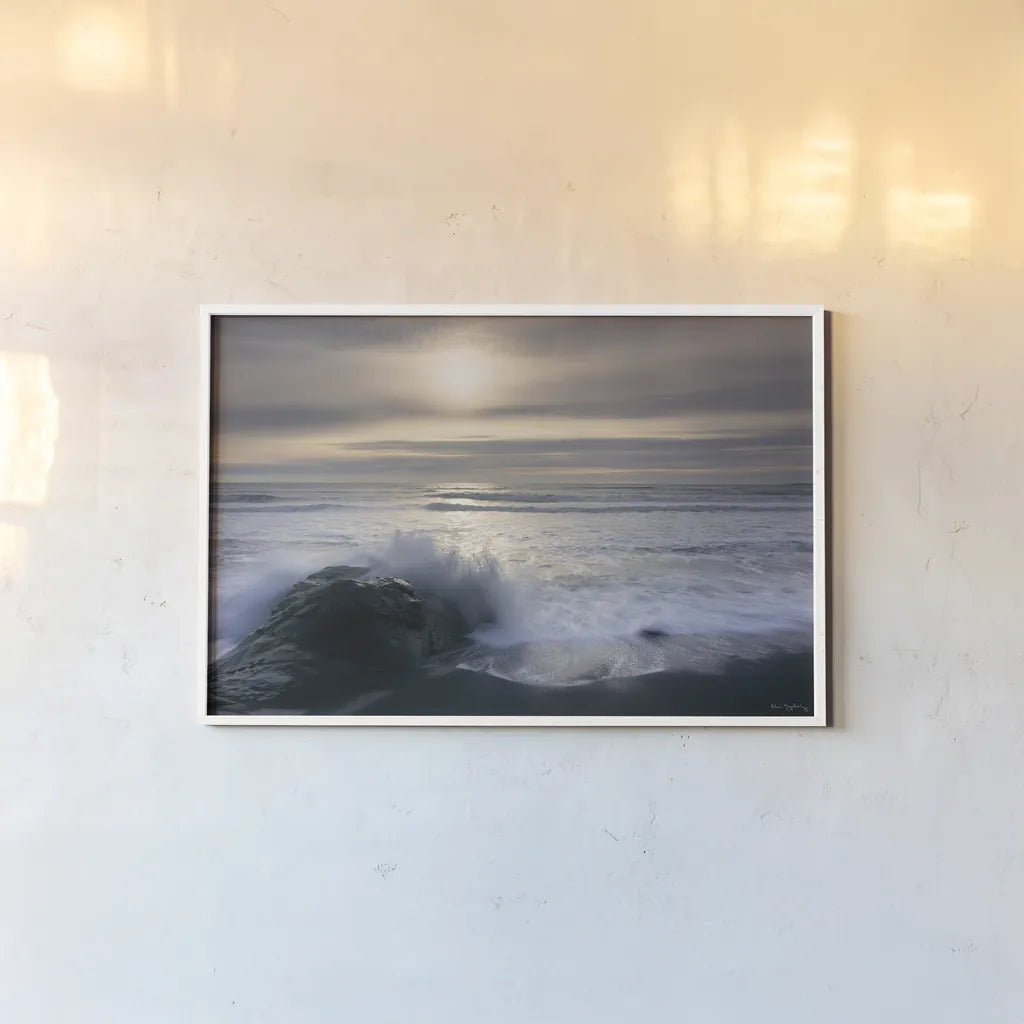 Tides and Waves Sunset III by Alan Majchrowicz. shown as a paper print in a white frame. Available as a archival giclee rolled canvas, fine art paper, or poster print. SKU 7753i.