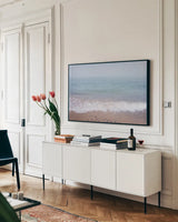 Whitefish Point Beach by Alan Majchrowicz. shown as a framed stretched canvas in a living room above a console. Available as a archival giclee rolled canvas, fine art paper, or poster print. SKU 61443i.