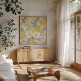Buttercups I by Albena Hristova. Shown in a natural wood frame in a cozy modern living room. Available as an archival giclee rolled canvas, fine art paper, or poster print. SKU 22473a.