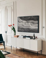 Currents Gray Black White by Albena Hristova. shown as a framed stretched canvas in a living room above a console. Available as a archival giclee rolled canvas, fine art paper, or poster print. SKU 33324i.