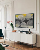 Eclipse by Albena Hristova. shown as a framed stretched canvas in a living room above a console. Available as a archival giclee rolled canvas, fine art paper, or poster print. SKU 71835i.