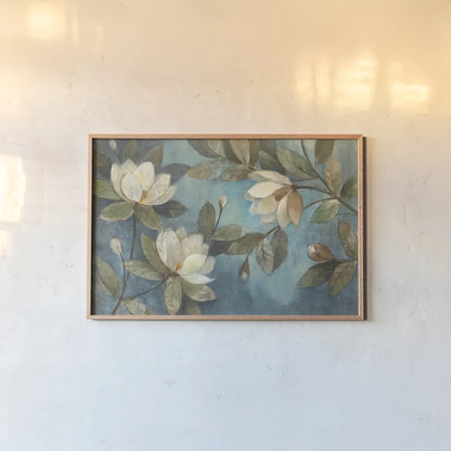 Floating Magnolia by Albena Hristova. shown as a paper print in a natural frame. Available as a archival giclee rolled canvas, fine art paper, or poster print. SKU 5071i.