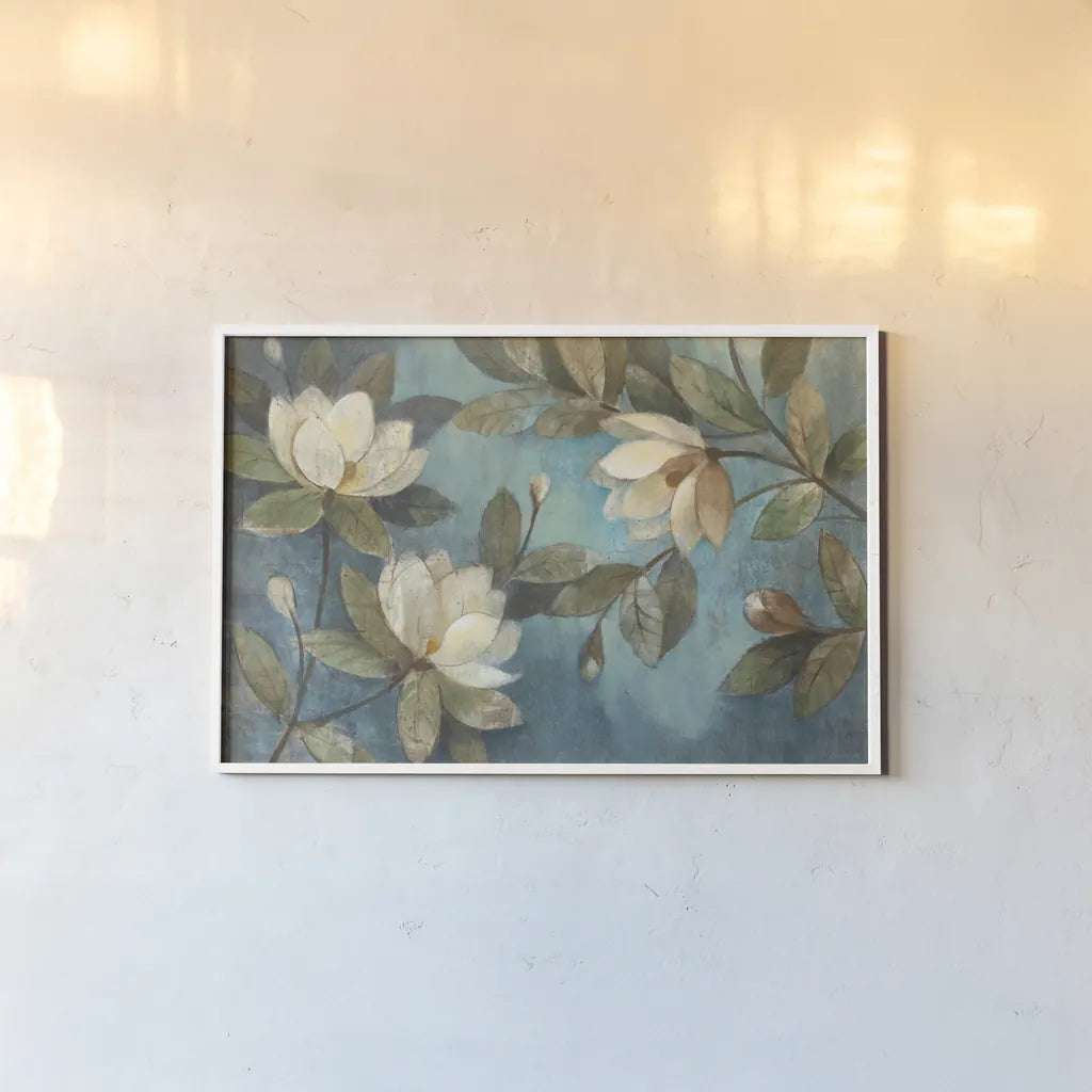 Floating Magnolia by Albena Hristova. shown as a paper print in a white frame. Available as a archival giclee rolled canvas, fine art paper, or poster print. SKU 5071i.