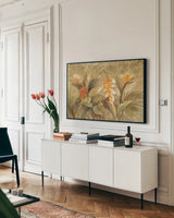 Gilded Tropics by Albena Hristova. shown as a framed stretched canvas in a living room above a console. Available as a archival giclee rolled canvas, fine art paper, or poster print. SKU 54422i.