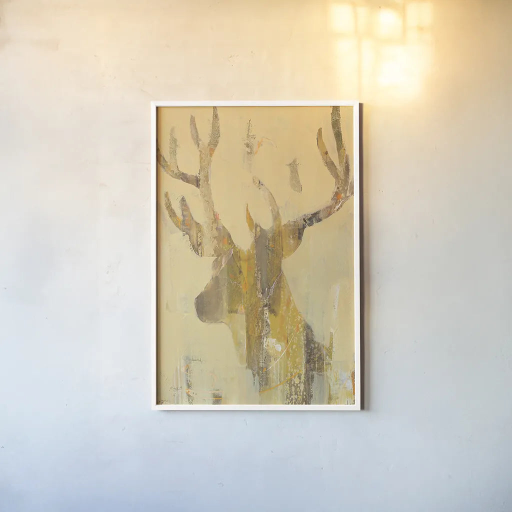 Golden Antlers II by Albena Hristova. shown as a paper print in a white frame. Available as a archival giclee rolled canvas, fine art paper, or poster print. SKU 28366h.