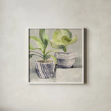 Greenery Still Life with Navy by Albena Hristova. Shown in a crisp white glass frame for a clean and minimalist style. Available as an archival giclee rolled canvas, fine art paper, or poster print. SKU 55337a.