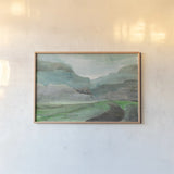 Misted Valley by Albena Hristova. shown as a paper print in a natural frame. Available as a archival giclee rolled canvas, fine art paper, or poster print. SKU 68564i.