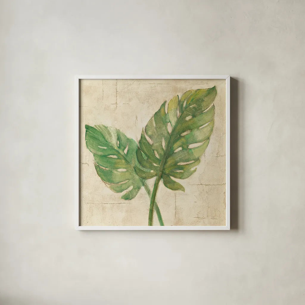 Monstera Leaves Neutral Crop by Albena Hristova. Shown in a crisp white glass frame for a clean and minimalist style. Available as an archival giclee rolled canvas, fine art paper, or poster print. SKU 24274a.