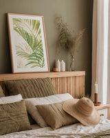 Palms I Bright by Albena Hristova. shown as a paper print in a natural frame. Available as a archival giclee rolled canvas, fine art paper, or poster print. SKU 48327h.