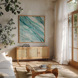 Silver Springs I Blue Green by Albena Hristova. Shown in a natural wood frame in a cozy modern living room. Available as an archival giclee rolled canvas, fine art paper, or poster print. SKU 44871a.