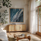 Splash Indigo by Albena Hristova. Shown in a natural wood frame in a cozy modern living room. Available as an archival giclee rolled canvas, fine art paper, or poster print. SKU 26882a.