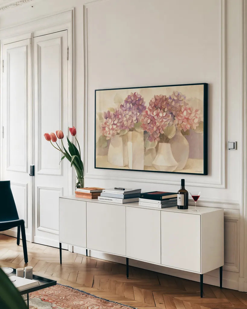 Sunlit Hydrangeas by Albena Hristova. shown as a framed stretched canvas in a living room above a console. Available as a archival giclee rolled canvas, fine art paper, or poster print. SKU 54426i.