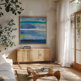 Tidal Dreams IV by Albena Hristova. Shown in a natural wood frame in a cozy modern living room. Available as an archival giclee rolled canvas, fine art paper, or poster print. SKU 93883a.