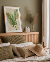 Tropical Leaves Neutral by Albena Hristova. shown as a paper print in a natural frame. Available as a archival giclee rolled canvas, fine art paper, or poster print. SKU 35860h.