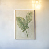 Tropical Leaves Neutral by Albena Hristova. shown as a paper print in a white frame. Available as a archival giclee rolled canvas, fine art paper, or poster print. SKU 35860h.
