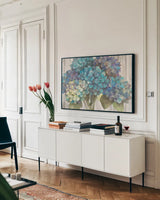 Turquoise Hydrangea on Barn Board by Albena Hristova. shown as a framed stretched canvas in a living room above a console. Available as a archival giclee rolled canvas, fine art paper, or poster print. SKU 23459i.