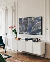 Twilight Palms by Albena Hristova. shown as a framed stretched canvas in a living room above a console. Available as a archival giclee rolled canvas, fine art paper, or poster print. SKU 70618i.
