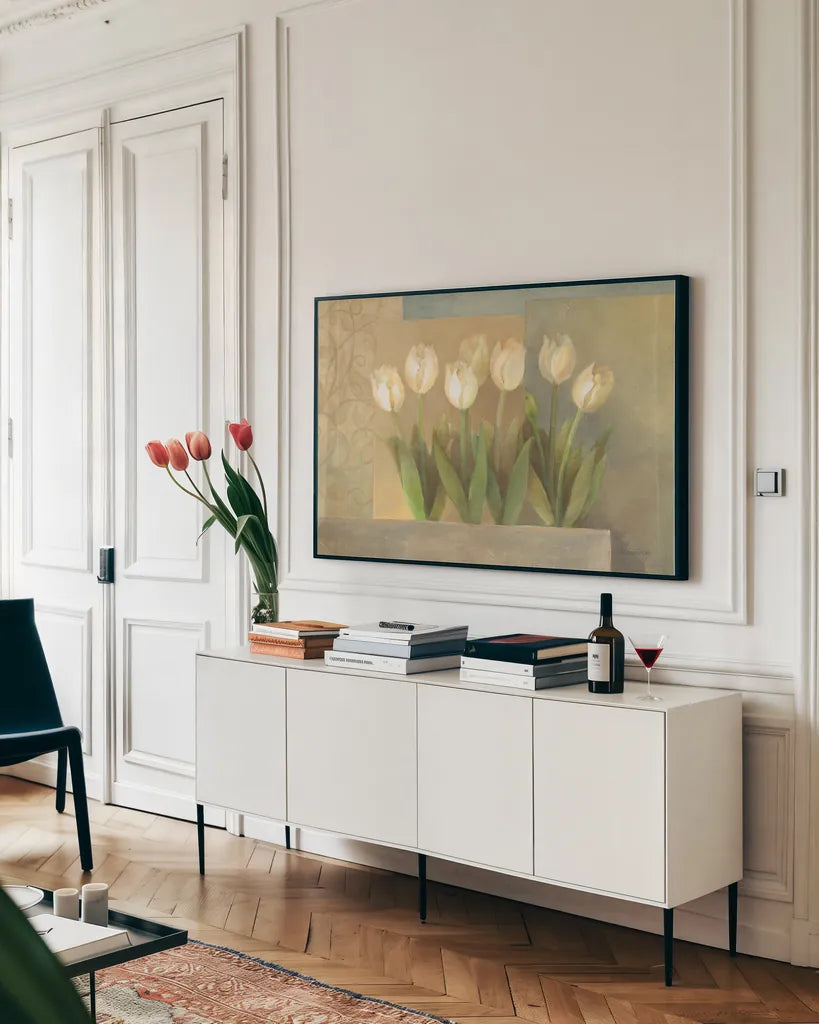 White Tulips Crop by Albena Hristova. shown as a framed stretched canvas in a living room above a console. Available as a archival giclee rolled canvas, fine art paper, or poster print. SKU 6384i.