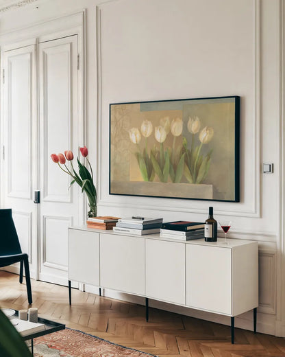 White Tulips Crop by Albena Hristova. shown as a framed stretched canvas in a living room above a console. Available as a archival giclee rolled canvas, fine art paper, or poster print. SKU 6384i.