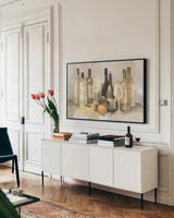 Wine and Fruit II v2 Light by Albena Hristova. shown as a framed stretched canvas in a living room above a console. Available as a archival giclee rolled canvas, fine art paper, or poster print. SKU 51871i.