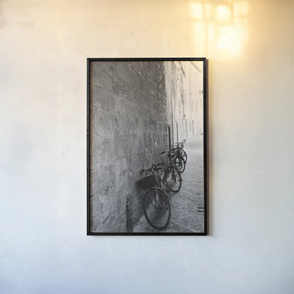 Bicycles in the Alley by Aledanda. shown as a paper print in a black flame. Available as a archival giclee rolled canvas, fine art paper, or poster print. SKU 67688h.