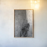 Bicycles in the Alley by Aledanda. shown as a paper print in a natural frame. Available as a archival giclee rolled canvas, fine art paper, or poster print. SKU 67688h.