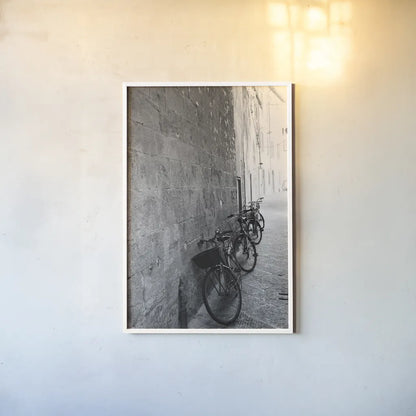 Bicycles in the Alley by Aledanda. shown as a paper print in a white frame. Available as a archival giclee rolled canvas, fine art paper, or poster print. SKU 67688h.