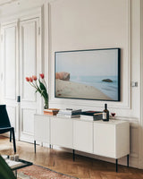 Coastal Rocks by Aledanda. shown as a framed stretched canvas in a living room above a console. Available as a archival giclee rolled canvas, fine art paper, or poster print. SKU 46203i.