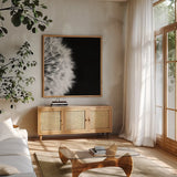 Dandelion on Black II by Aledanda. Shown in a natural wood frame in a cozy modern living room. Available as an archival giclee rolled canvas, fine art paper, or poster print. SKU 55251a.