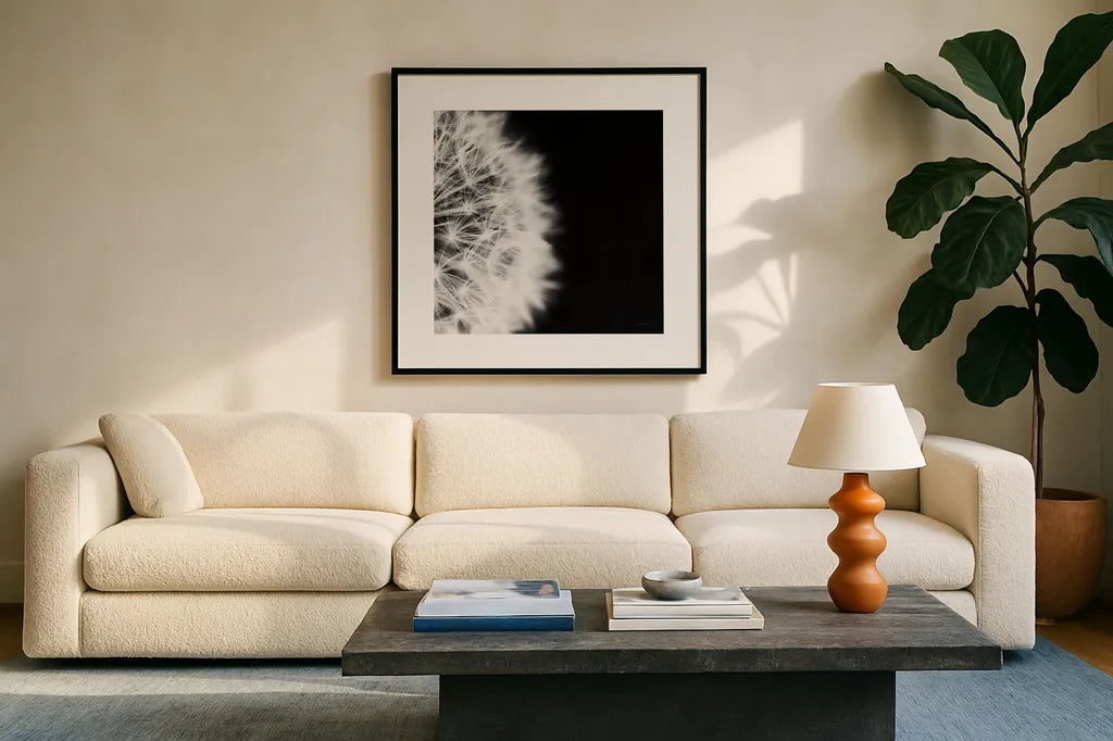 Dandelion on Black II by Aledanda. Displayed in a glass frame with matte in a clean modern living room. Available as an archival giclee rolled canvas, fine art paper, or poster print. SKU 55251a.
