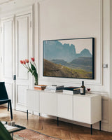 Dolomiti I Color by Aledanda. shown as a framed stretched canvas in a living room above a console. Available as a archival giclee rolled canvas, fine art paper, or poster print. SKU 78130i.