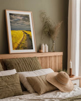 Down the Road by Aledanda. shown as a paper print in a natural frame. Available as a archival giclee rolled canvas, fine art paper, or poster print. SKU 38322h.