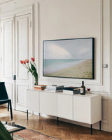 Early Morning Beach by Aledanda. shown as a framed stretched canvas in a living room above a console. Available as a archival giclee rolled canvas, fine art paper, or poster print. SKU 46204i.