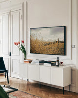 Fencerow by Aledanda. shown as a framed stretched canvas in a living room above a console. Available as a archival giclee rolled canvas, fine art paper, or poster print. SKU 63226i.