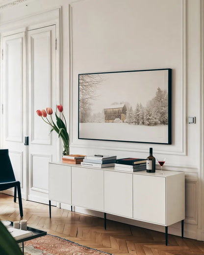 First Snow by Aledanda. shown as a framed stretched canvas in a living room above a console. Available as a archival giclee rolled canvas, fine art paper, or poster print. SKU 38290i.