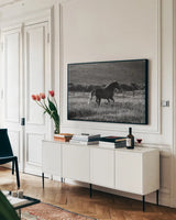 Going Home by Aledanda. shown as a framed stretched canvas in a living room above a console. Available as a archival giclee rolled canvas, fine art paper, or poster print. SKU 38299i.