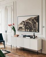 Horses Three Sepia by Aledanda. shown as a framed stretched canvas in a living room above a console. Available as a archival giclee rolled canvas, fine art paper, or poster print. SKU 53122i.