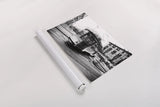In Town by Aledanda. shown as a rolled paper print. Available as archival giclee rolled canvas, fine art paper, or poster print. SKU 47849i.